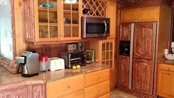 a kitchen with a stove and a microwave