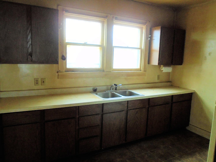 205 North 12th Street Rochelle, IL 61068 - Photo 4 of 13 a bathroom with a sink and a bathtub