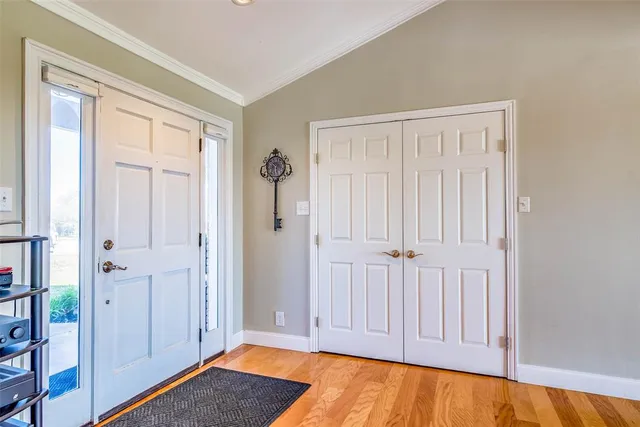 a living room with furniture a rug and a lamp