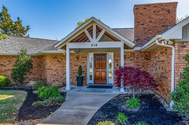 a view of a patio with a yard