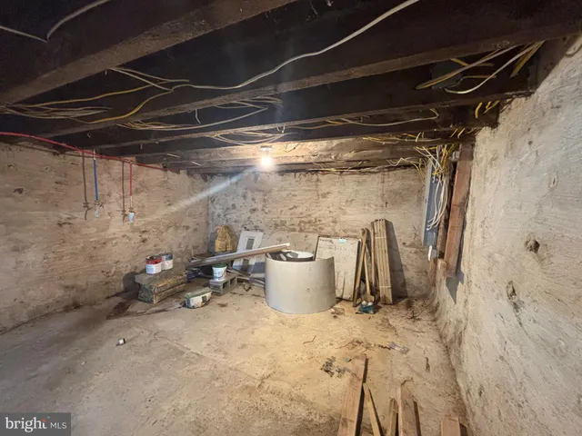 a view of a storage room with water heater and racks