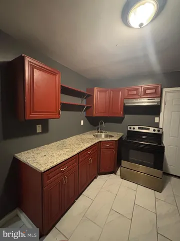 a kitchen with a stove and a microwave