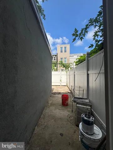 a room with a potted plant and outdoor seating