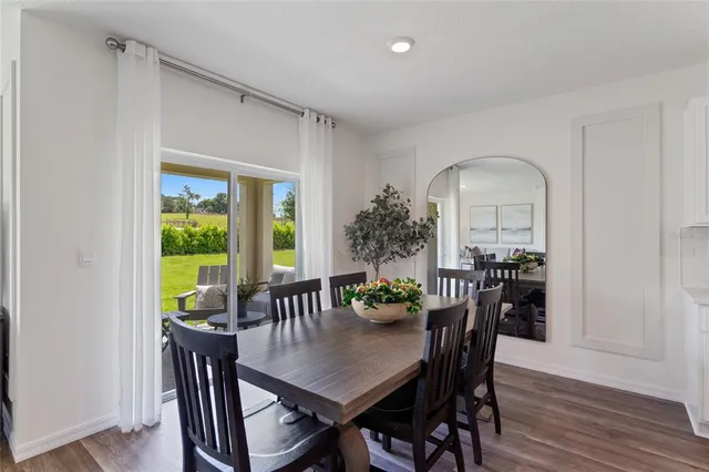 a view of a dining room with furniture and window