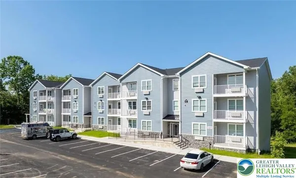 a view of a parked cars in front of a building
