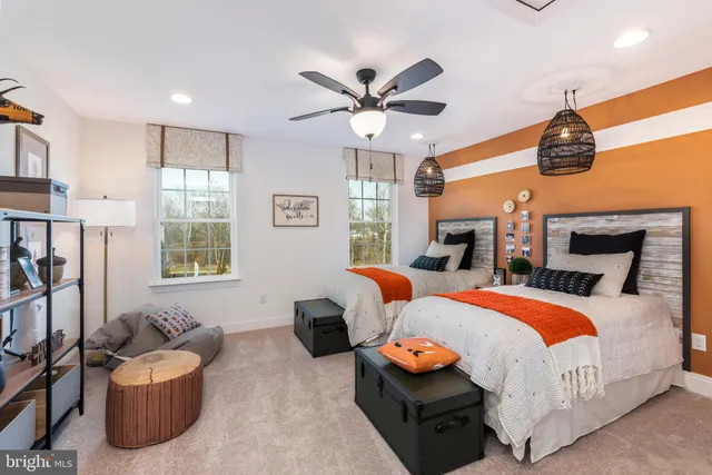 a bedroom with furniture and a chandelier