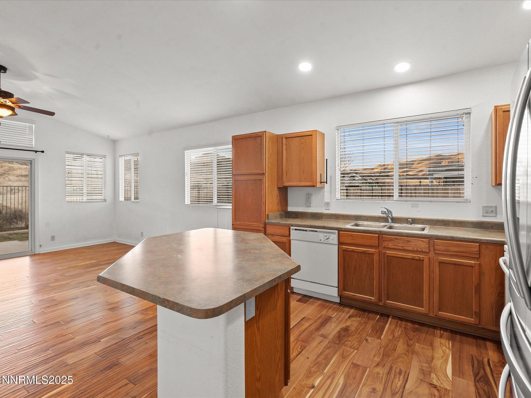 7260 Winterhill Court Reno, NV 89523 - Photo 6 of 39 a kitchen with stainless steel appliances granite countertop a stove a sink and a refrigerator
