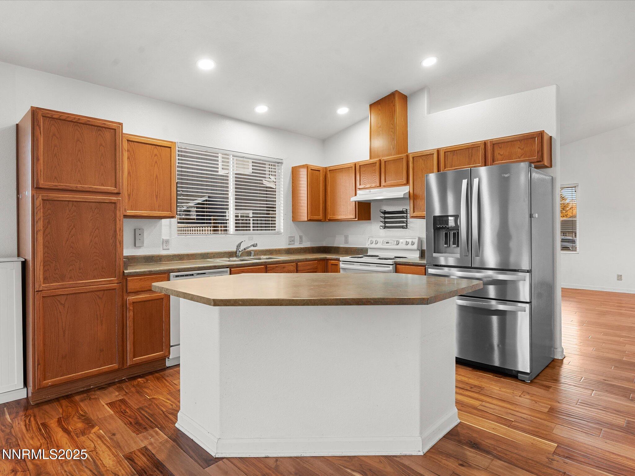 7260 Winterhill Court Reno, NV 89523 - Photo 9 of 39 a kitchen with stainless steel appliances granite countertop a refrigerator a stove a sink and a refrigerator