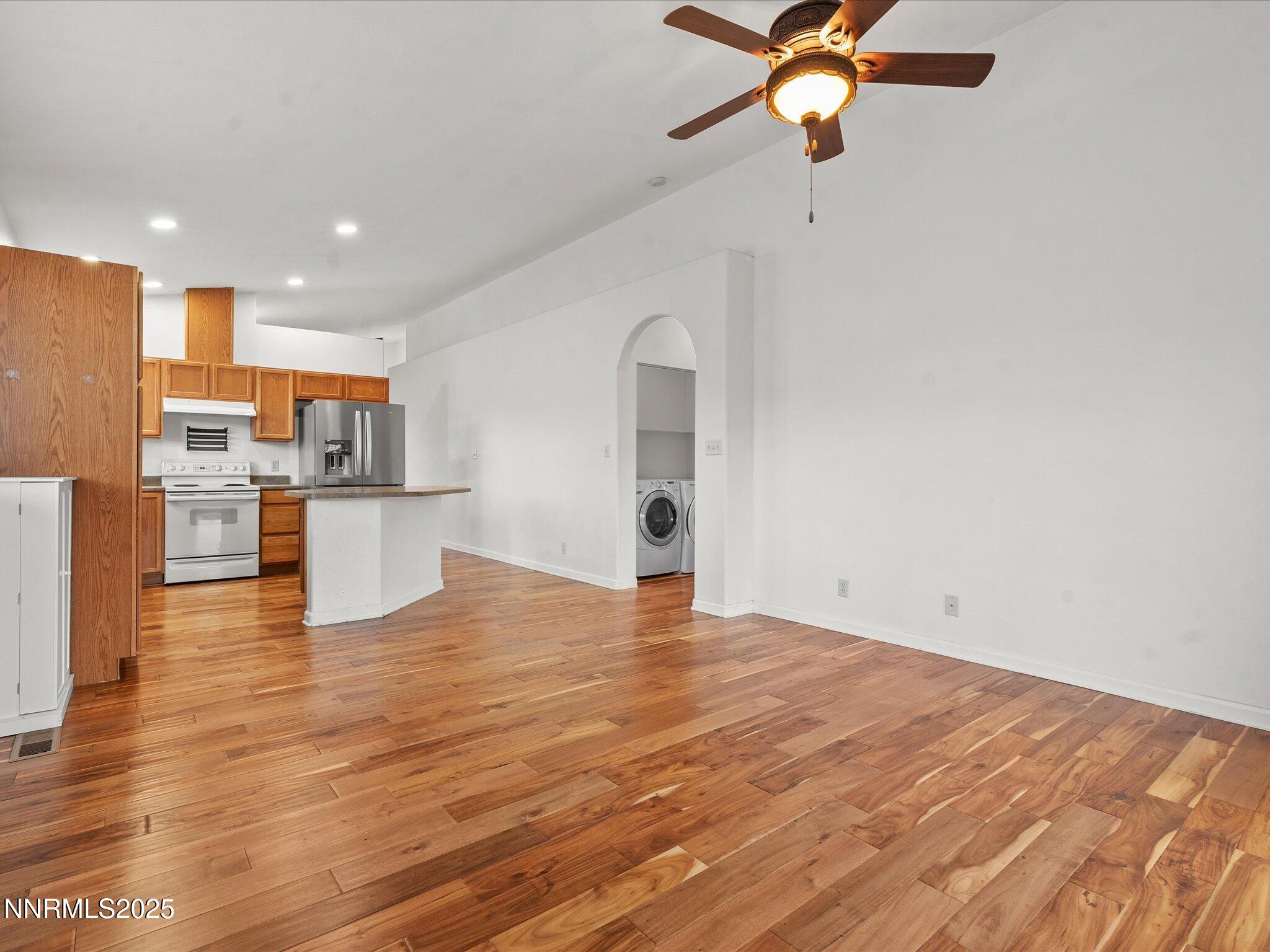 7260 Winterhill Court Reno, NV 89523 - Photo 10 of 39 a view of kitchen with wooden floor and a ceiling fan