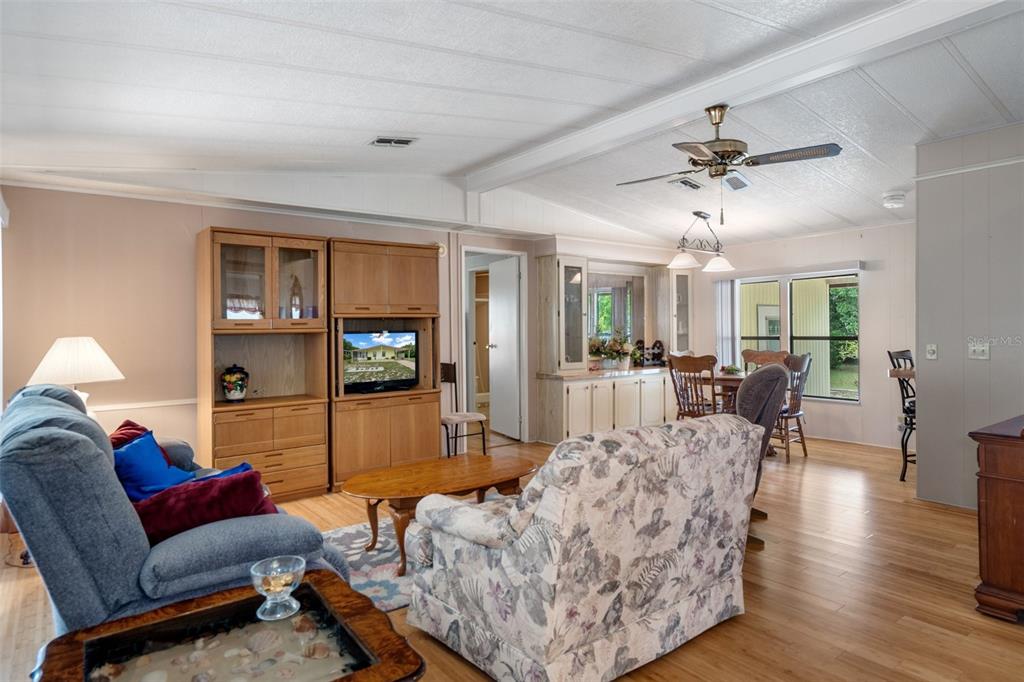 12306 Club House Road Brooksville, FL 34613 - Photo 16 of 36 a living room with furniture and wooden floor