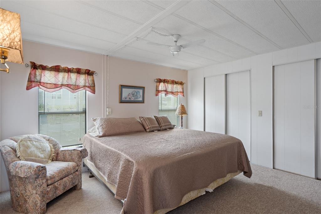 12306 Club House Road Brooksville, FL 34613 - Photo 22 of 36 a bedroom with a bed and couch