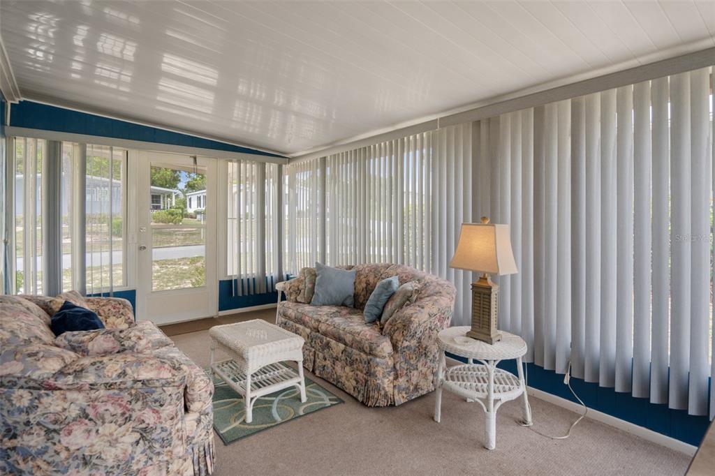 12306 Club House Road Brooksville, FL 34613 - Photo 30 of 36 a spacious bedroom with a bed and a couch