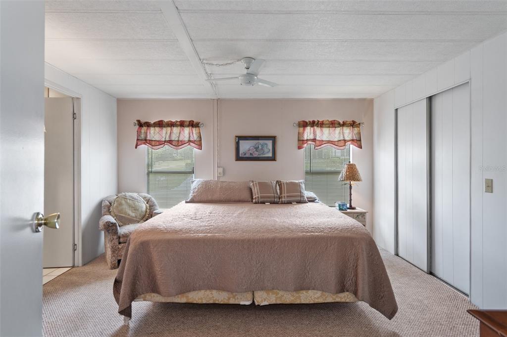 12306 Club House Road Brooksville, FL 34613 - Photo 6 of 36 a bedroom with a bed and a furniture