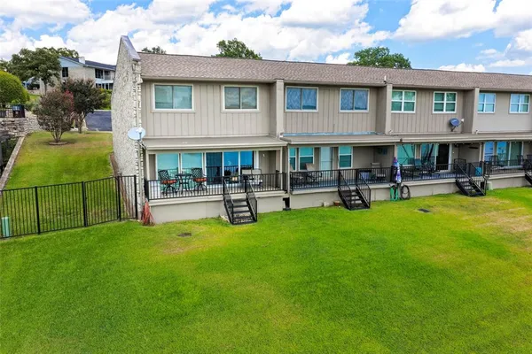 a house view with swimming pool and patio