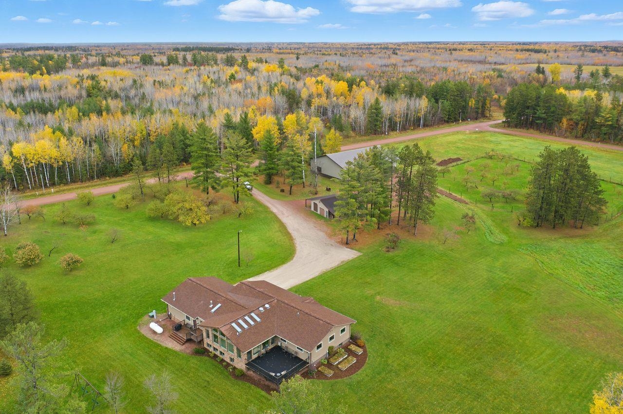 View from above of property with a heavily wooded area