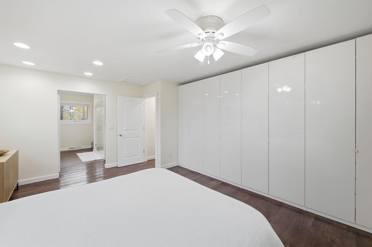 64903 Charles Johnson Road Ashland, WI 54806 - Photo 18 of 52 Bedroom featuring recessed lighting, dark wood-style floors, ceiling fan, and attic access