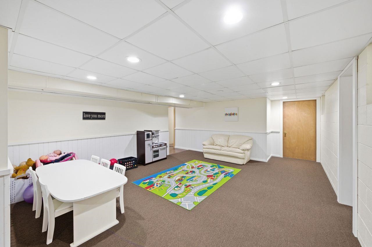 64903 Charles Johnson Road Ashland, WI 54806 - Photo 21 of 52 Recreation room with recessed lighting, carpet flooring, and a paneled ceiling