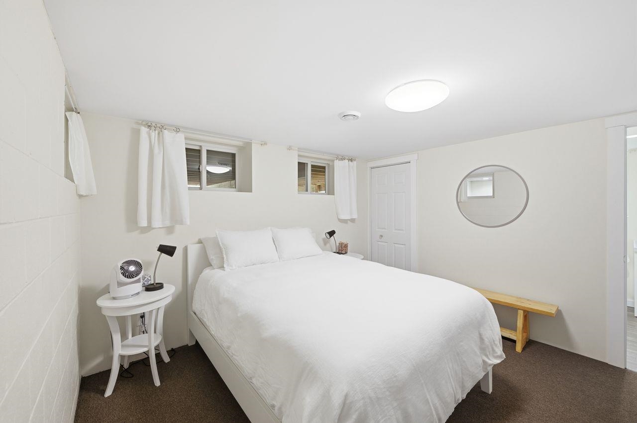 64903 Charles Johnson Road Ashland, WI 54806 - Photo 22 of 52 Bedroom with dark colored carpet
