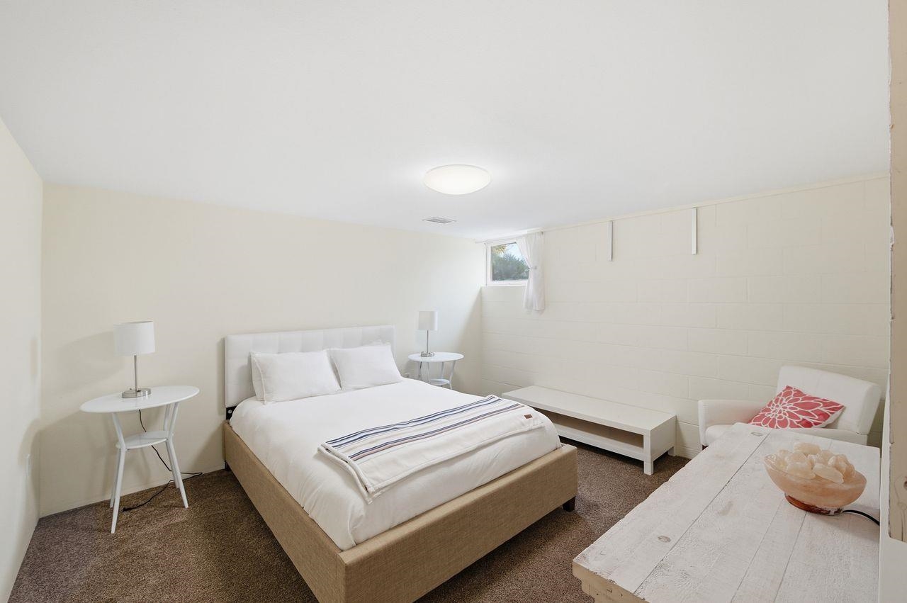 64903 Charles Johnson Road Ashland, WI 54806 - Photo 24 of 52 Bedroom featuring carpet floors and concrete block wall