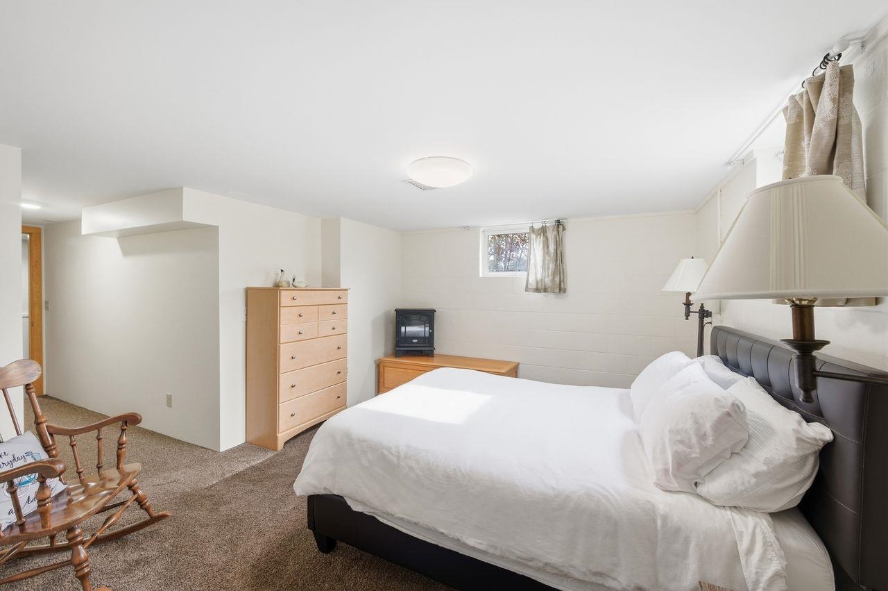 64903 Charles Johnson Road Ashland, WI 54806 - Photo 26 of 52 Bedroom featuring carpet floors and concrete block wall