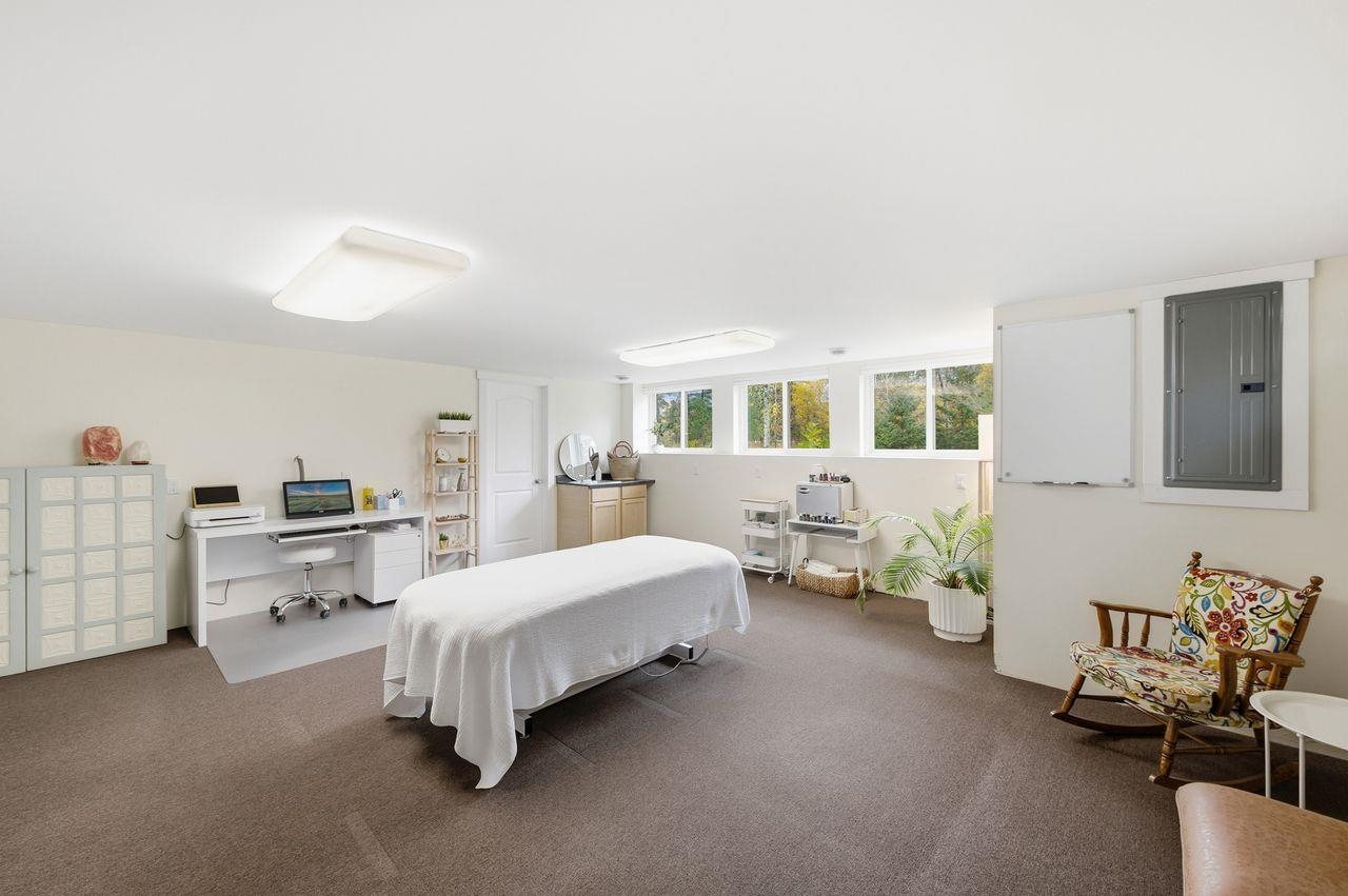 64903 Charles Johnson Road Ashland, WI 54806 - Photo 27 of 52 Bedroom featuring electric panel, an office area, and carpet