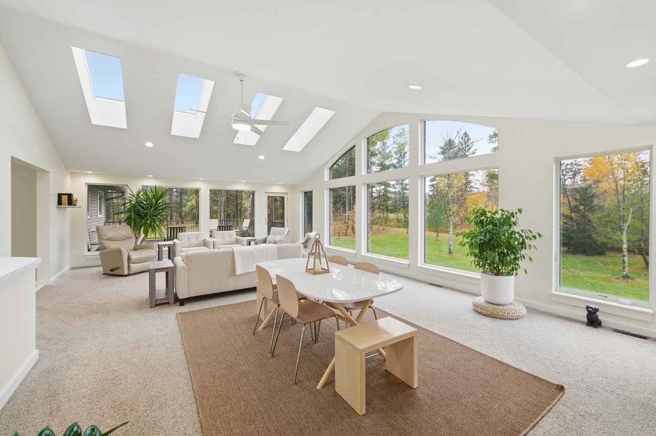 64903 Charles Johnson Road Ashland, WI 54806 - Photo 8 of 52 Sunroom / solarium featuring lofted ceiling and a skylight