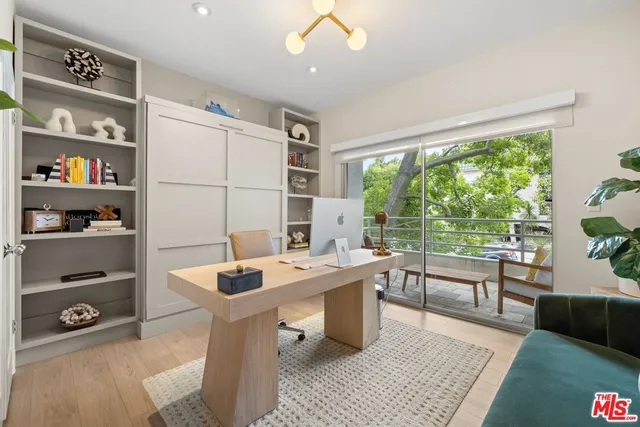 a room with table chairs and window