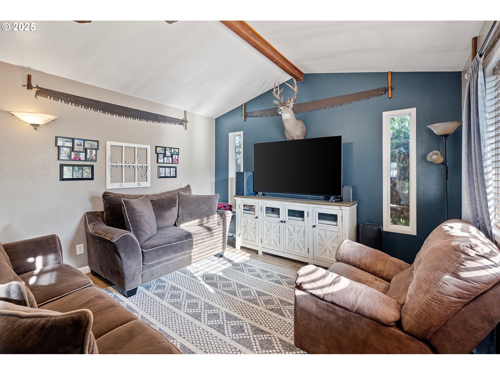 525 South 35th Street Springfield, OR 97478 - Photo 19 of 40 a living room with furniture and a flat screen tv