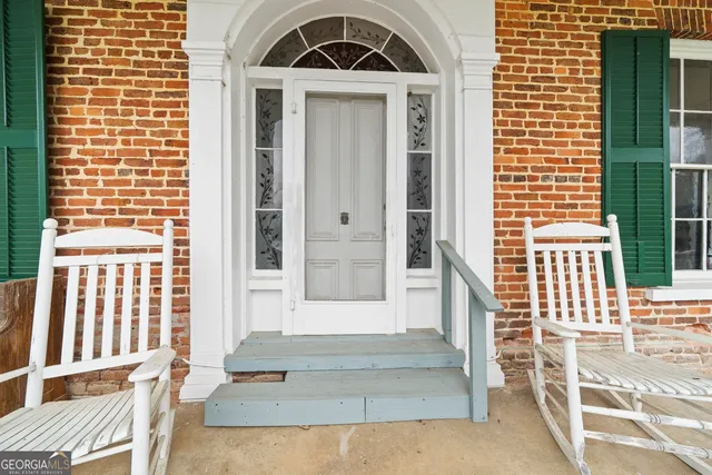 a front view of a house with a porch