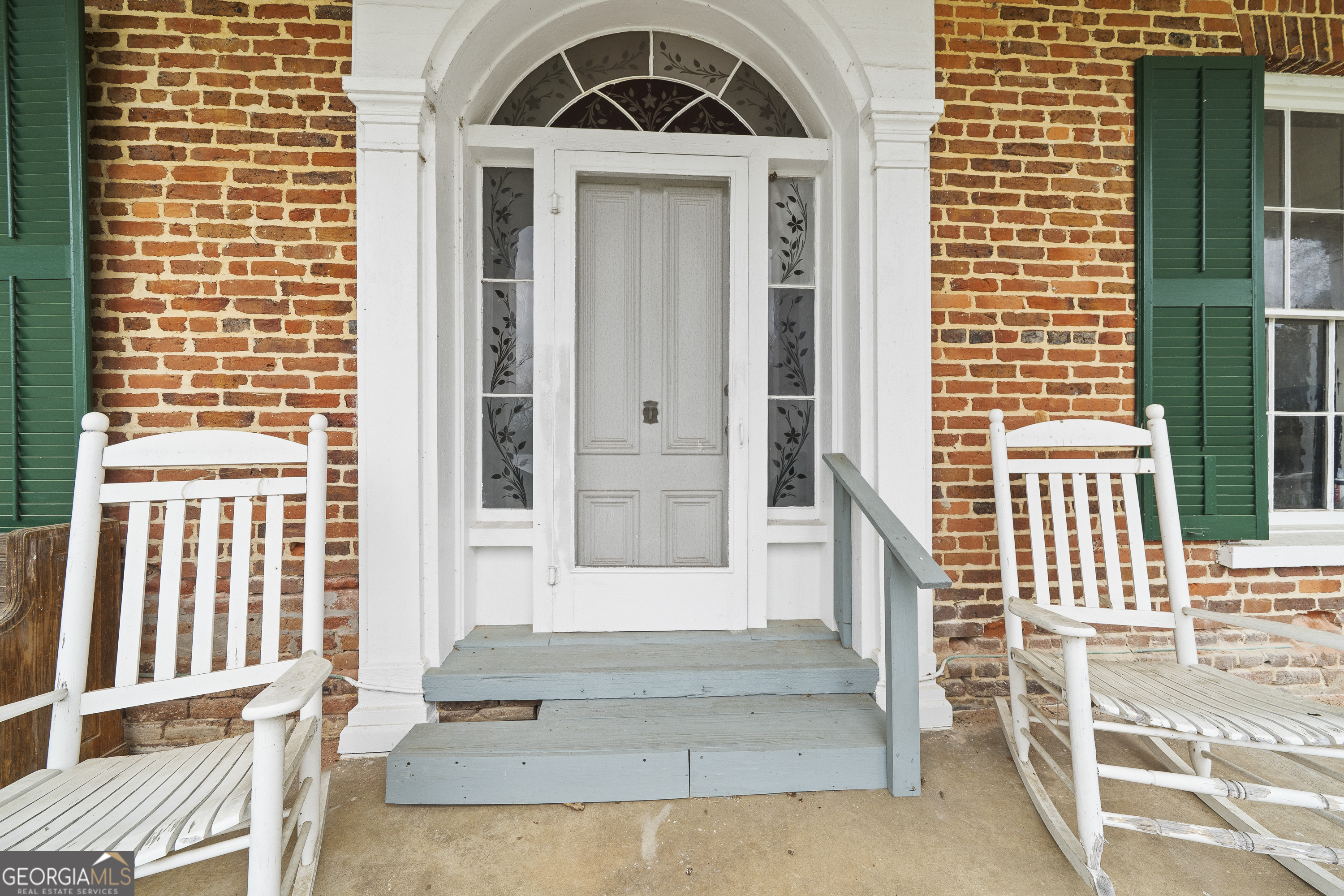 12871 Linton Road Sparta, GA 31087 - Photo 2 of 52 a front view of a house with a porch