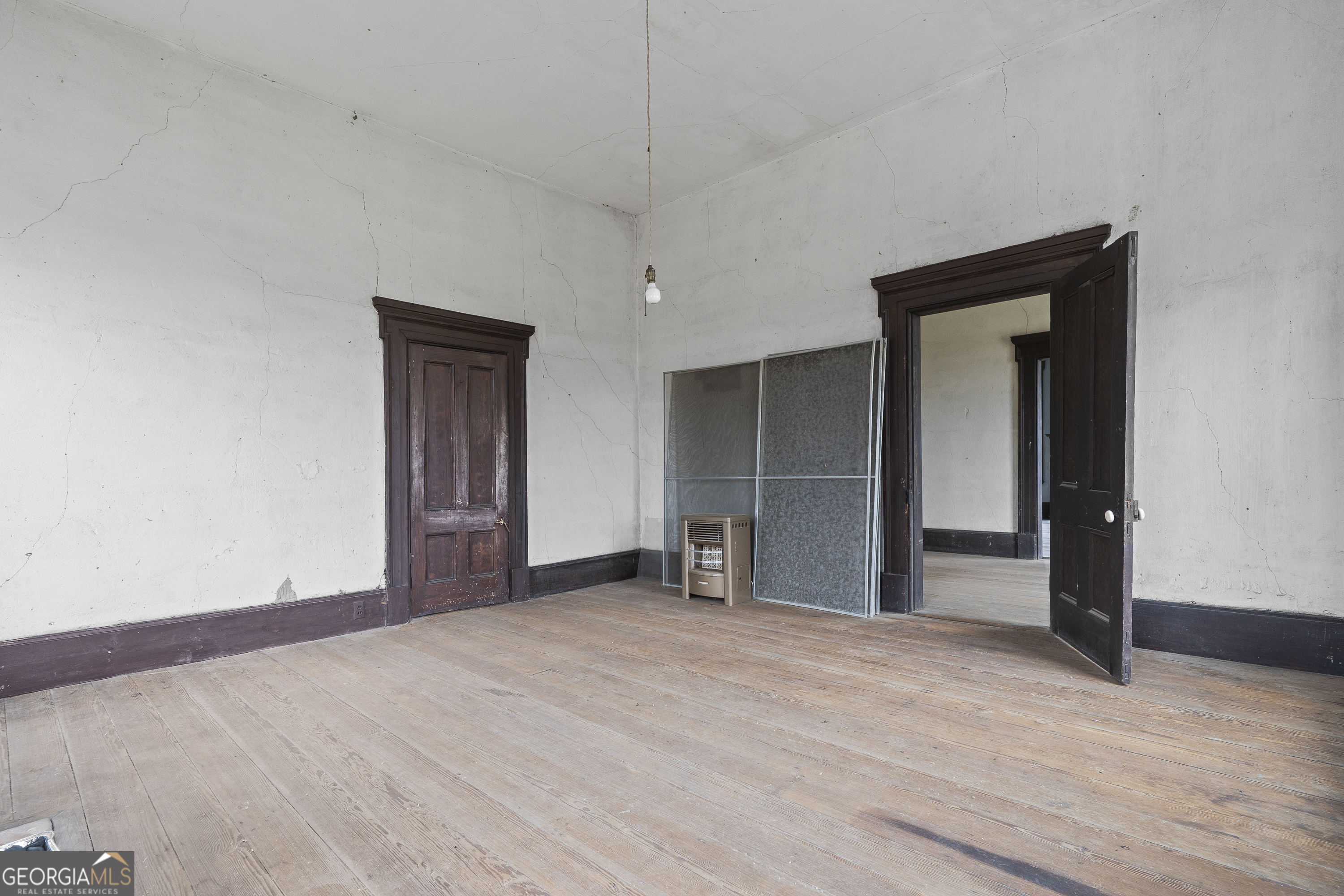 12871 Linton Road Sparta, GA 31087 - Photo 21 of 52 a view of empty room with wooden floor