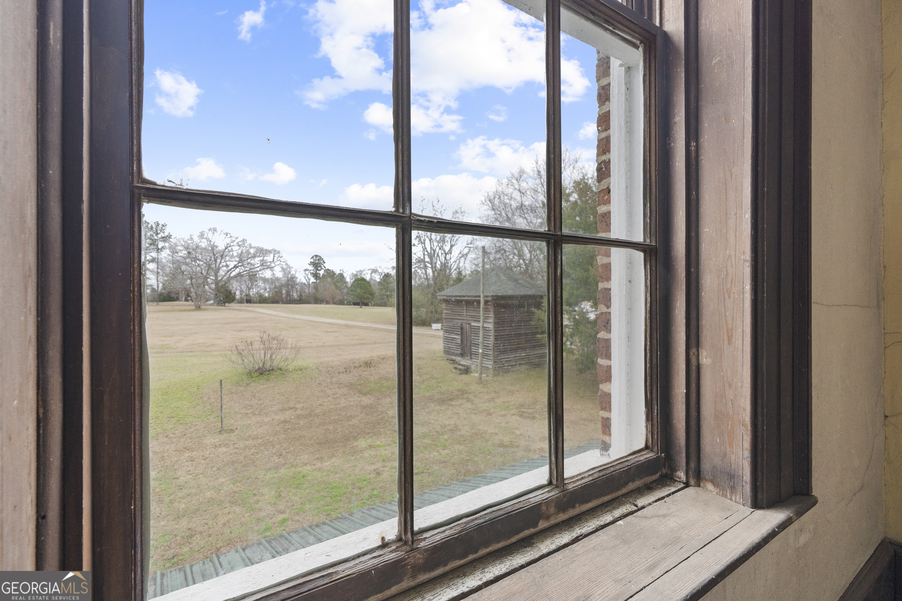 12871 Linton Road Sparta, GA 31087 - Photo 24 of 52 a view of a glass door and a window