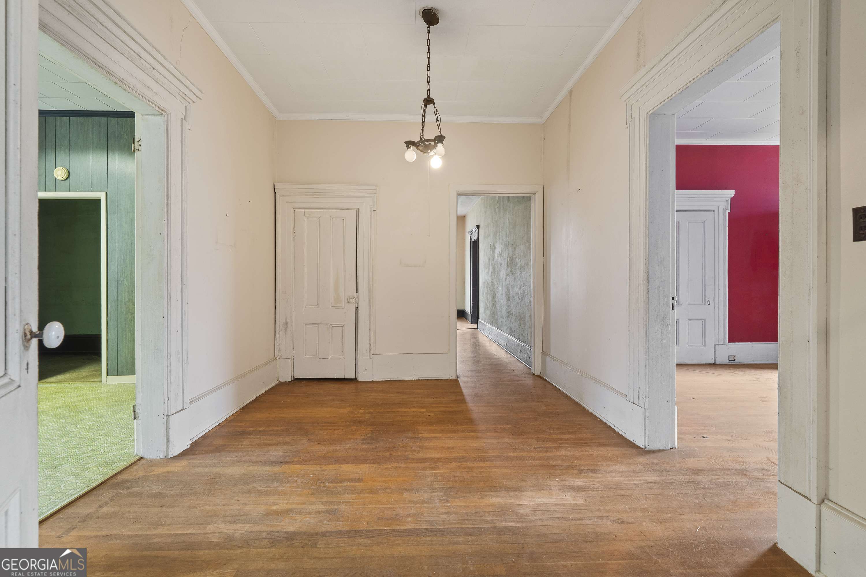 12871 Linton Road Sparta, GA 31087 - Photo 36 of 52 a view of a hallway with wooden floor and staircase