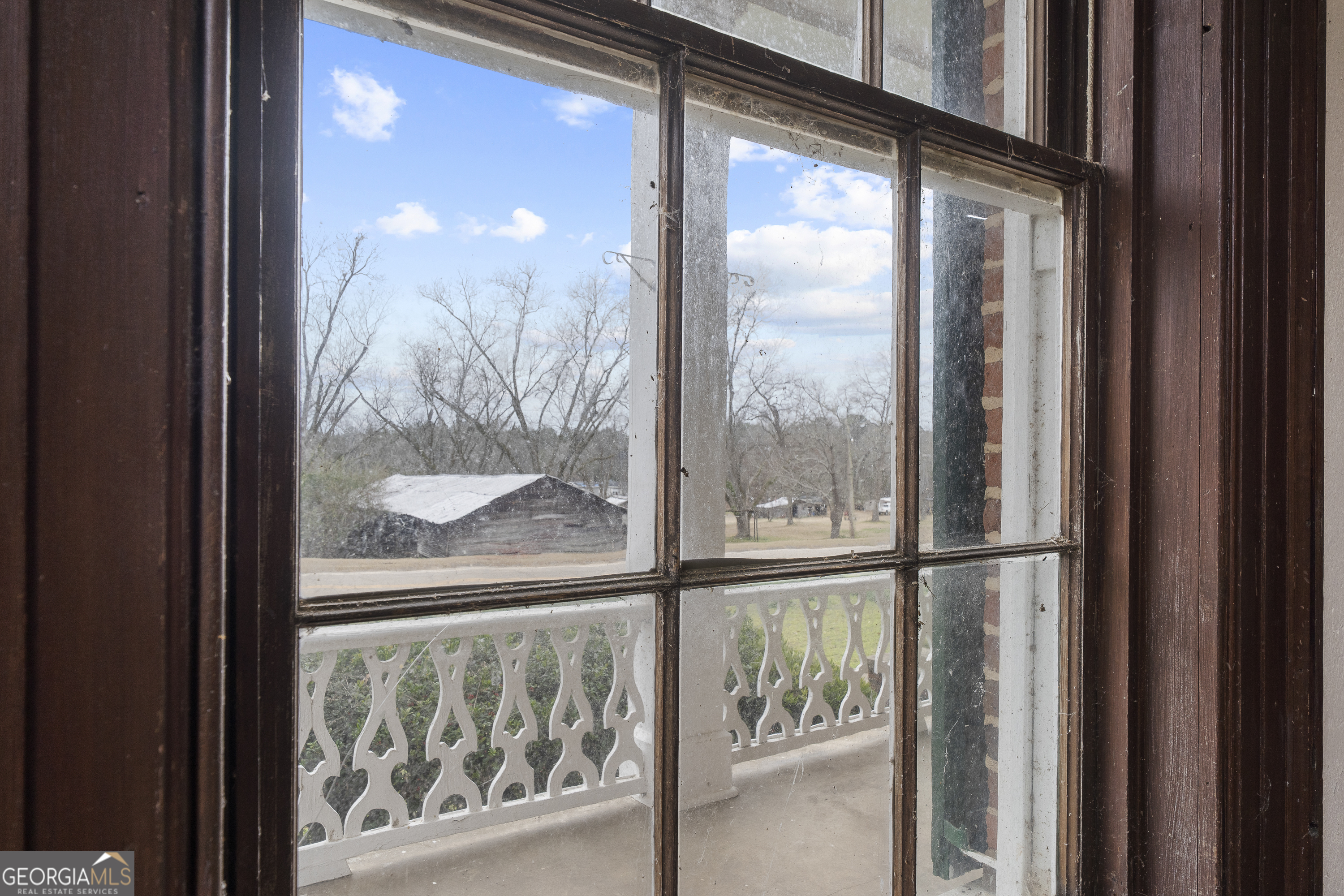12871 Linton Road Sparta, GA 31087 - Photo 37 of 52 a view of a glass door and windows