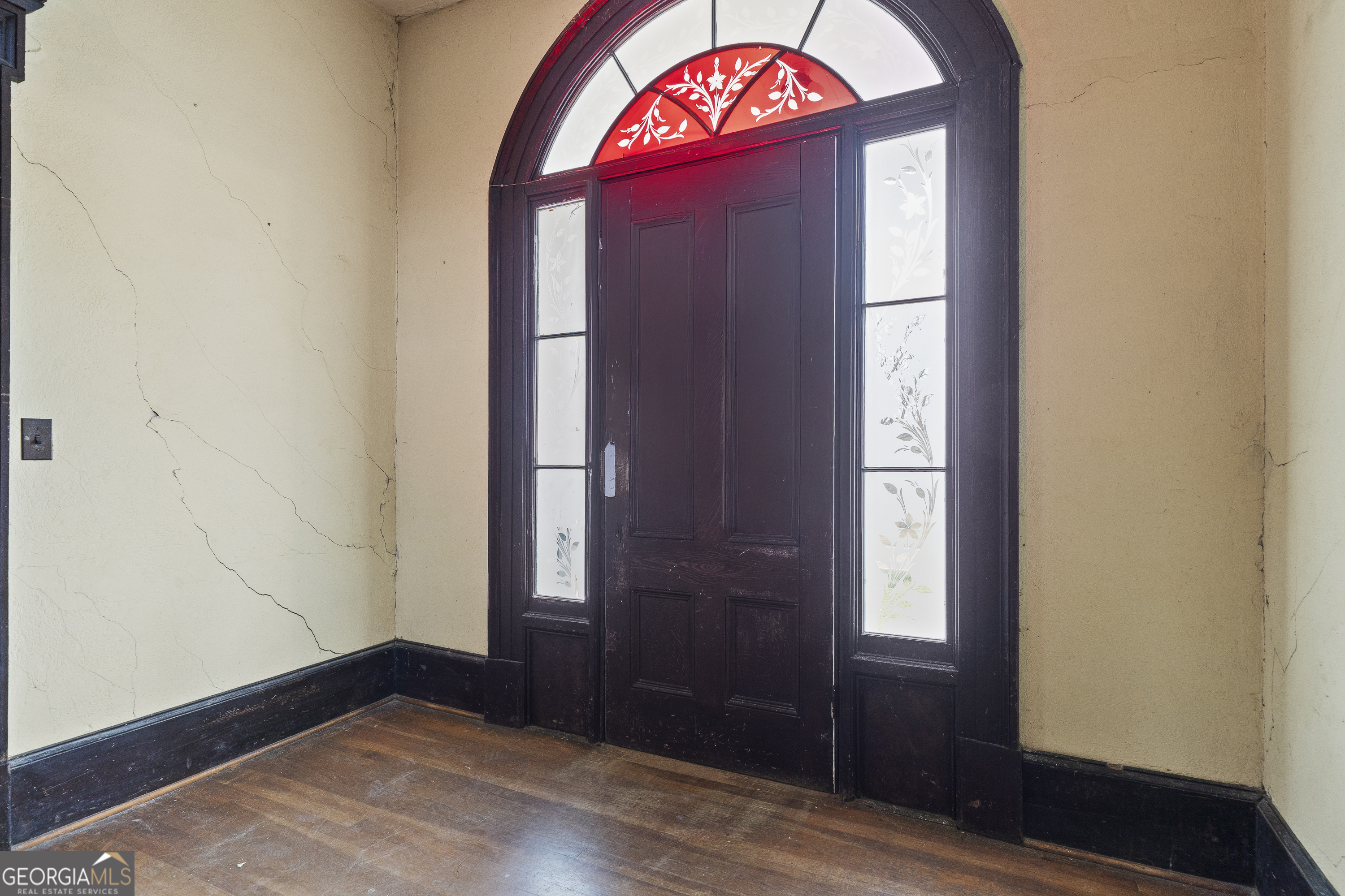 12871 Linton Road Sparta, GA 31087 - Photo 43 of 52 an empty room with wooden floor and window