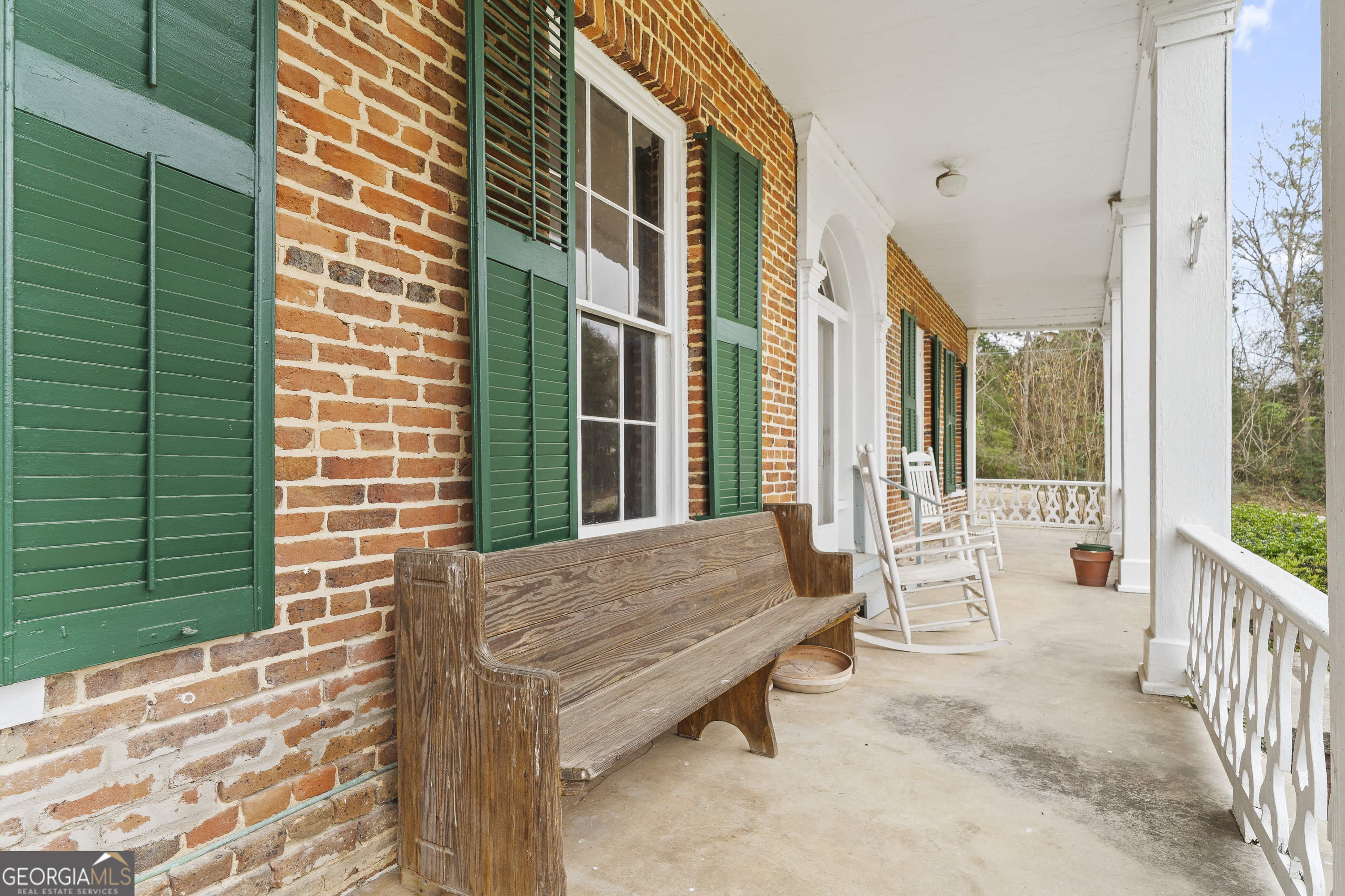 12871 Linton Road Sparta, GA 31087 - Photo 47 of 52 a balcony with furniture and a window