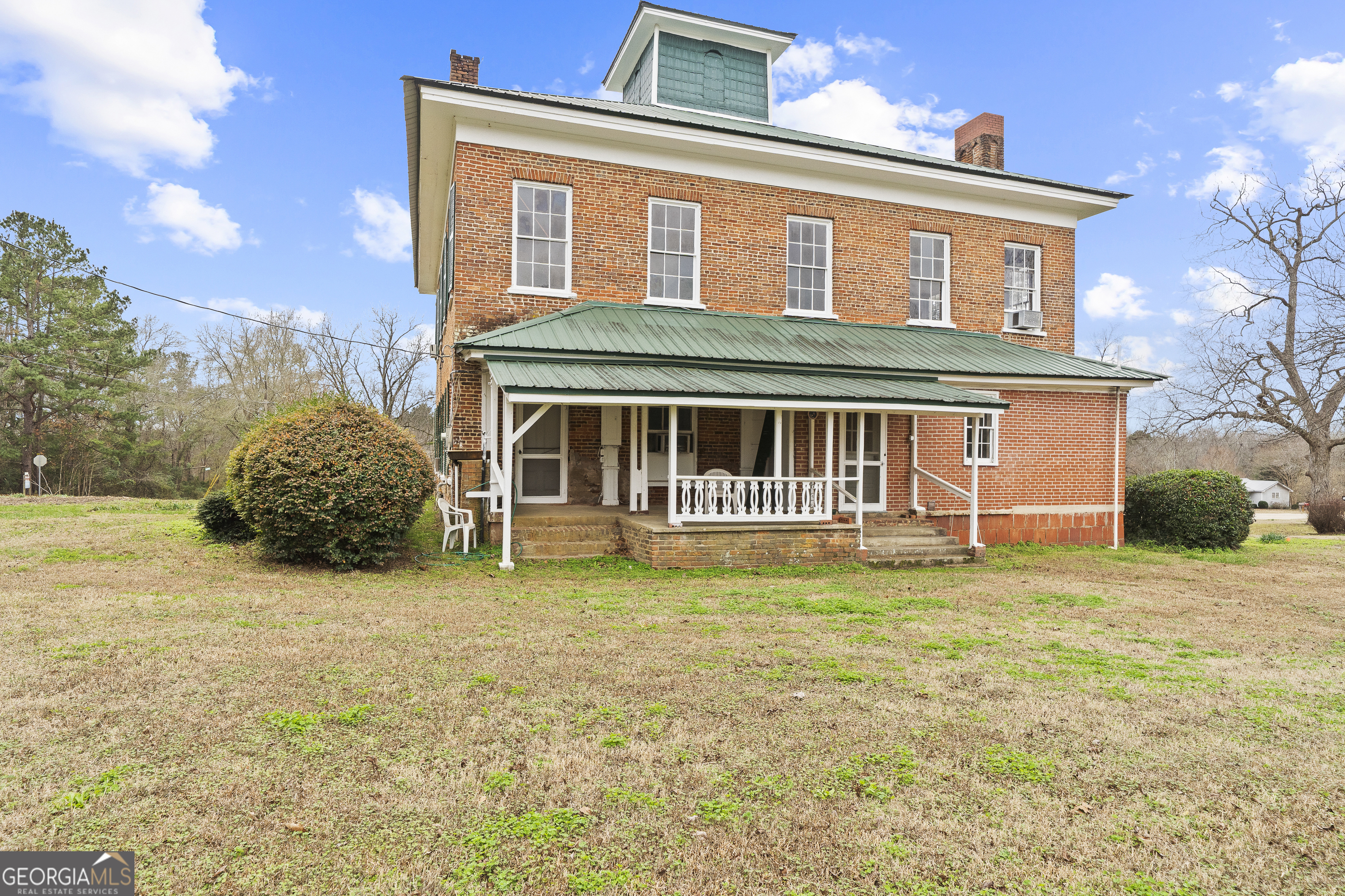 12871 Linton Road Sparta, GA 31087 - Photo 48 of 52 a front view of a house with a garden