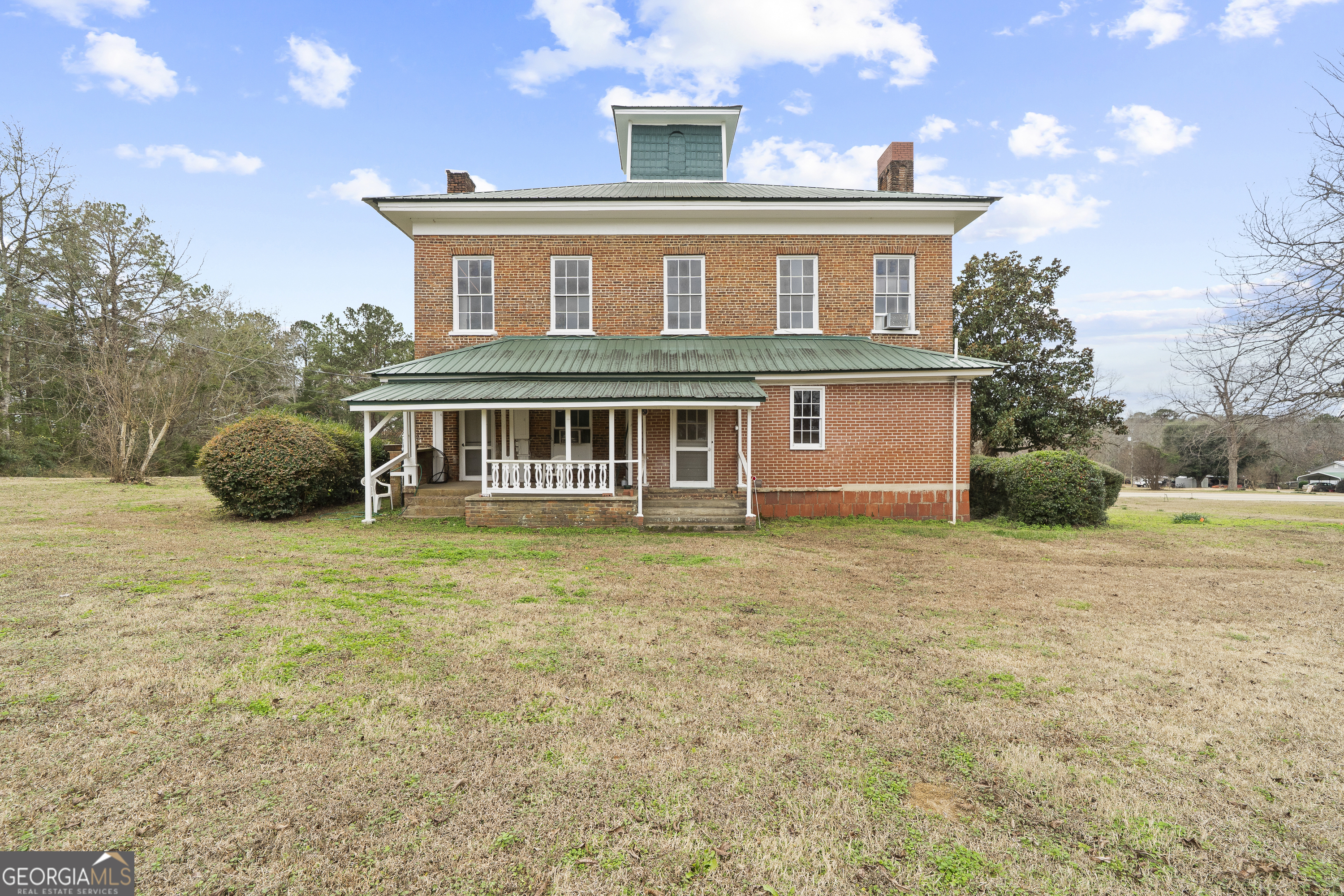 12871 Linton Road Sparta, GA 31087 - Photo 49 of 52 a front view of a house with a garden