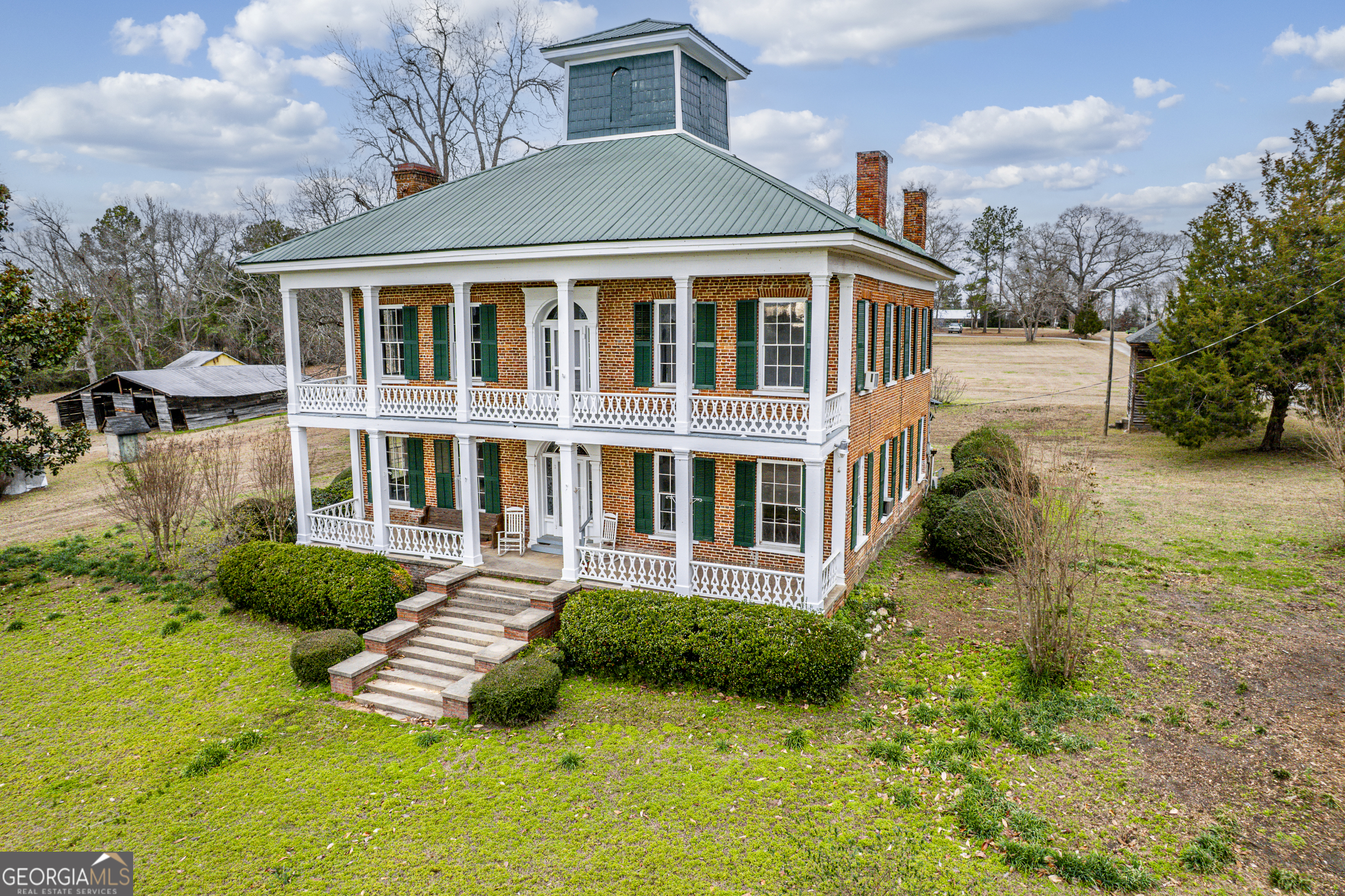 12871 Linton Road Sparta, GA 31087 - Photo 5 of 52 a front view of a house with yard and green space