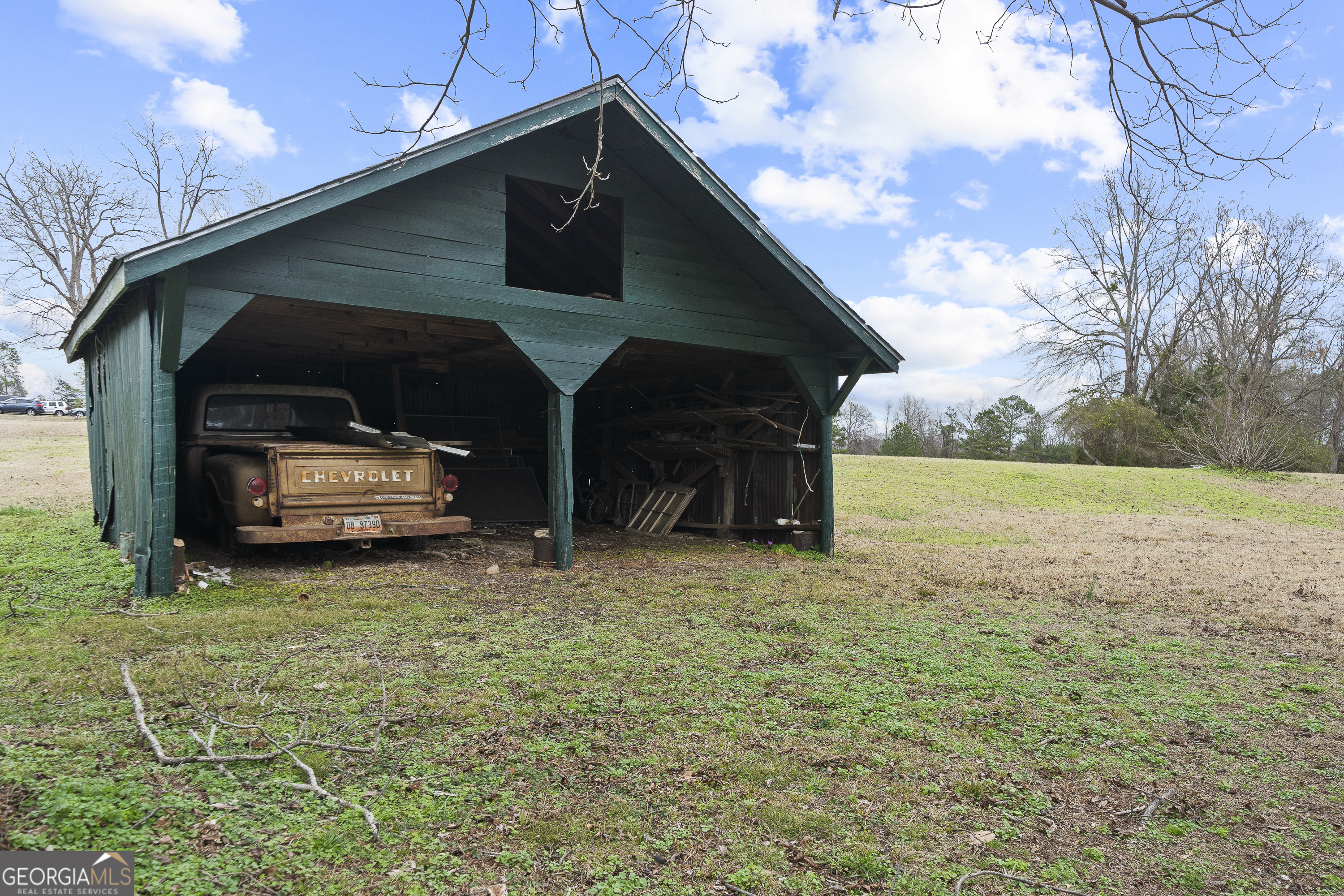 12871 Linton Road Sparta, GA 31087 - Photo 52 of 52 a car parked in front of a house