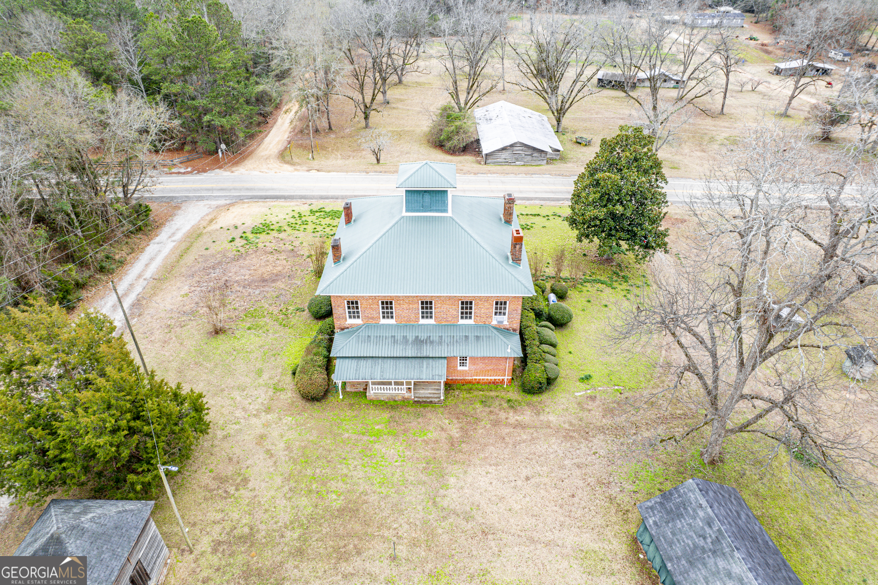 12871 Linton Road Sparta, GA 31087 - Photo 10 of 52 front view of a house with a yard