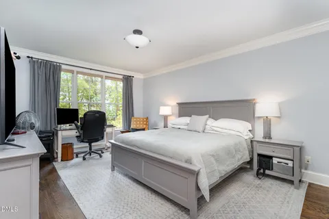 a bathroom with a sink a toilet and a window