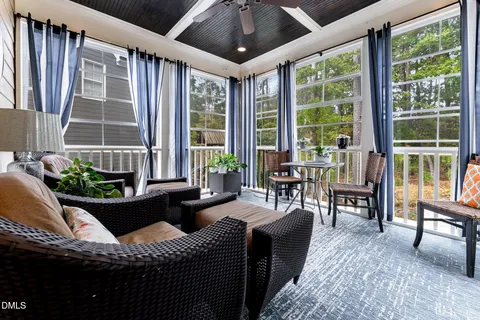 a bed room with a bed and a chair