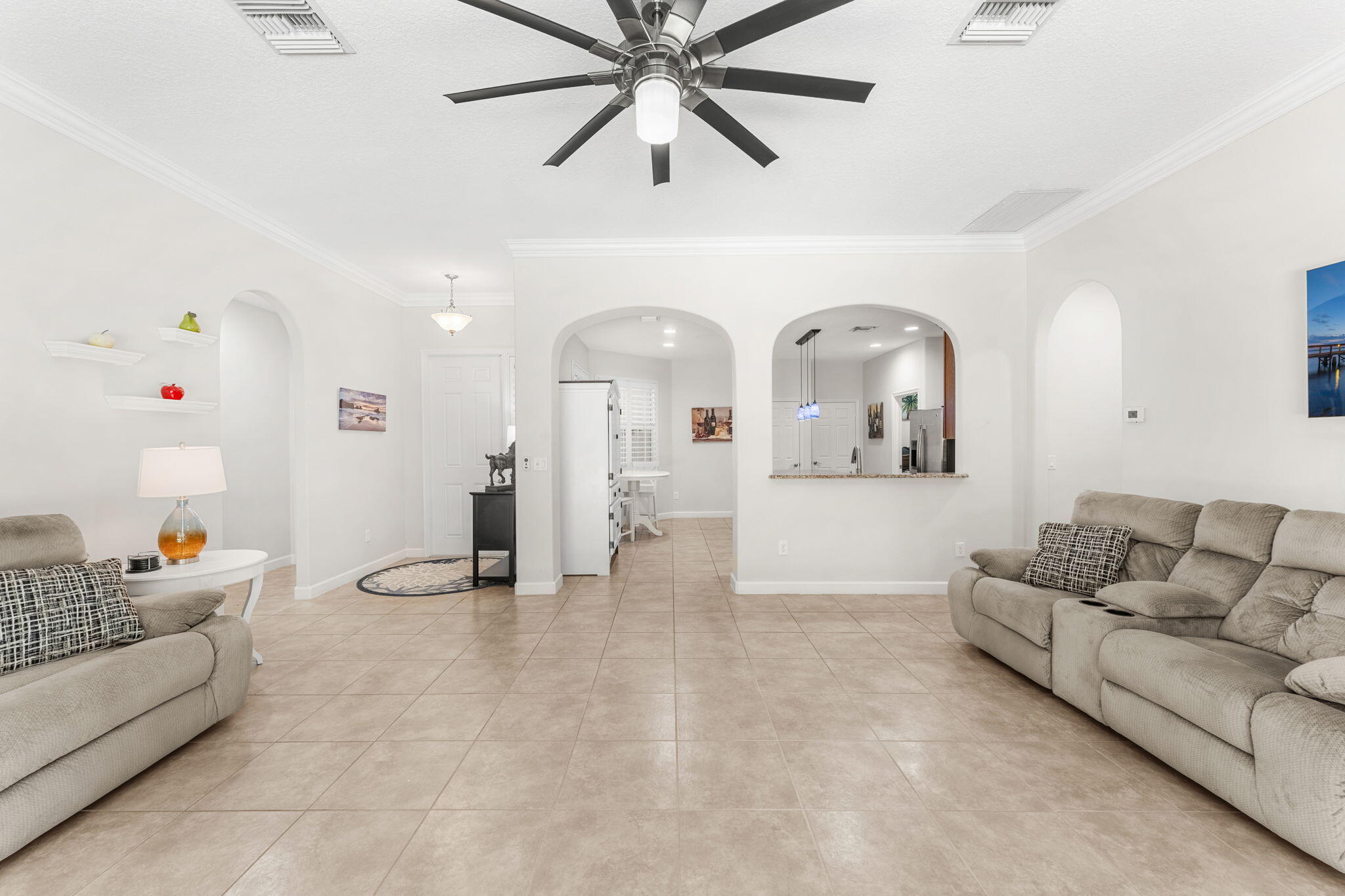 7657 Fieldstone Ranch Square Vero Beach, FL 32967 - Photo 11 of 52 a living room with furniture and a couch