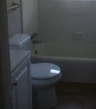 a bathroom with a toilet and a sink