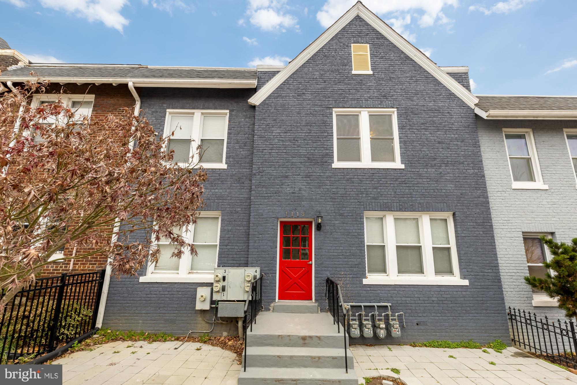 1113 Penn Street Northeast, Unit 4 Washington, DC 20002 - Photo 2 of 22 Charming townhouse with vibrant red door.