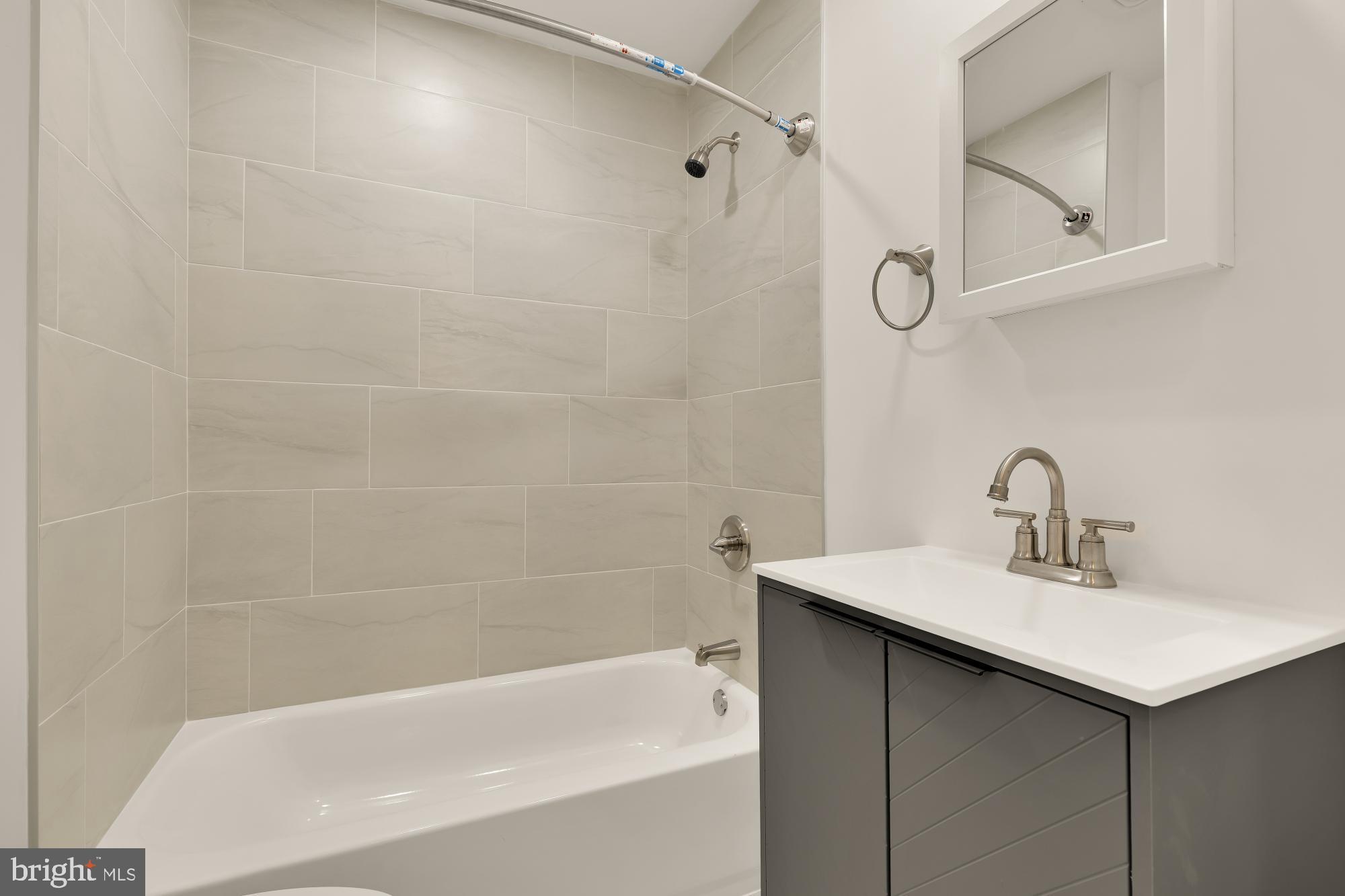 1113 Penn Street Northeast, Unit 4 Washington, DC 20002 - Photo 7 of 22 Sleek modern bathroom with elegant finishes.