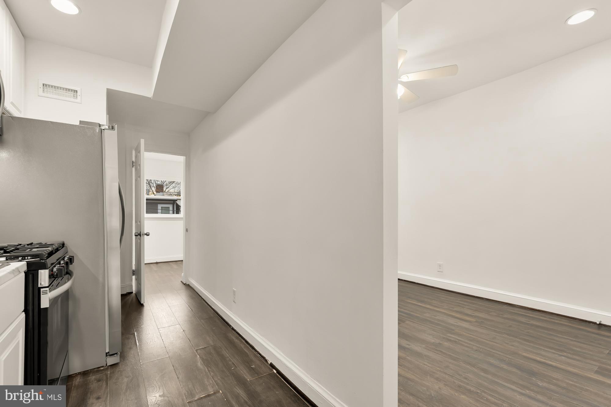 1113 Penn Street Northeast, Unit 4 Washington, DC 20002 - Photo 8 of 22 Bright and airy hallway with modern finishes.