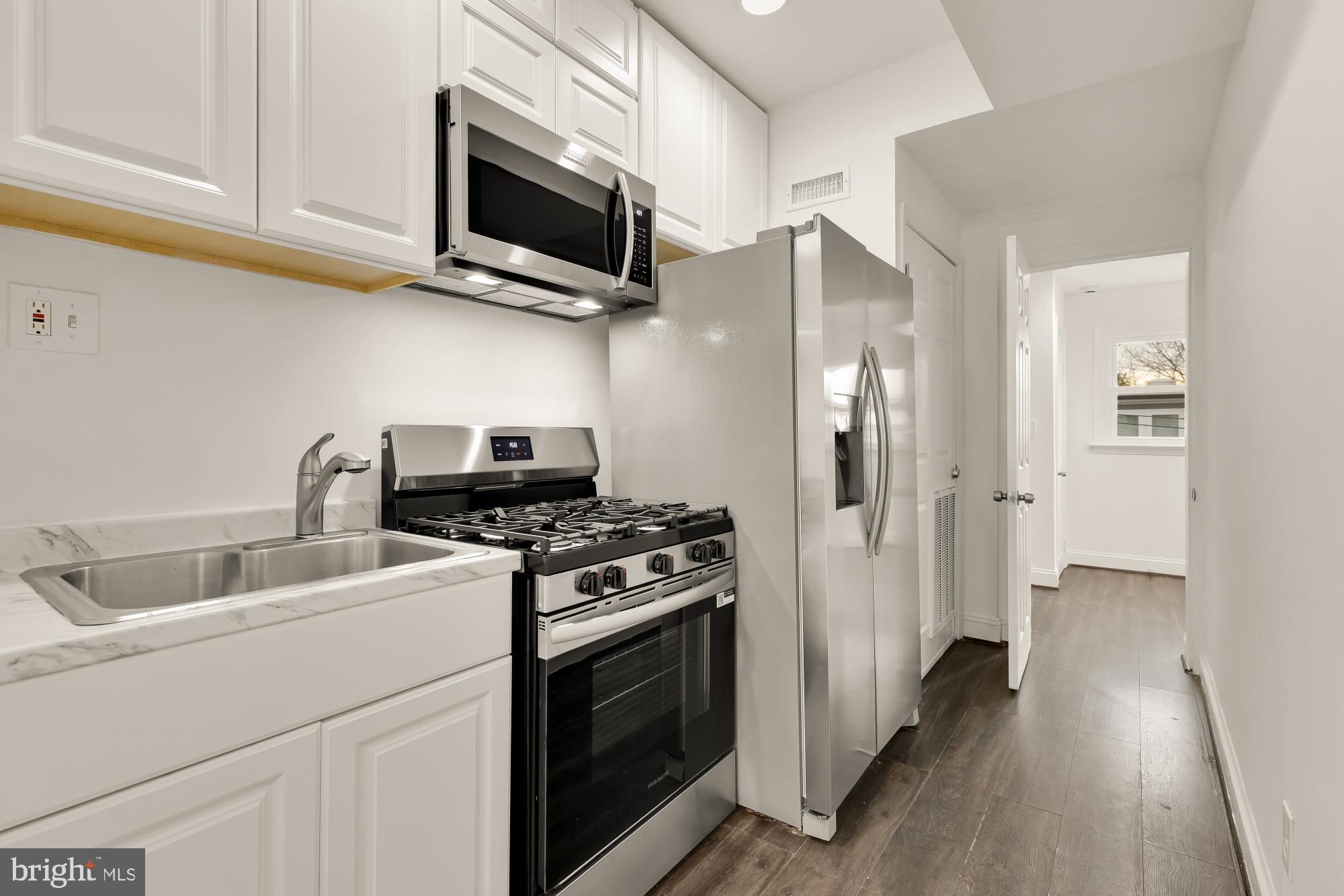 1113 Penn Street Northeast, Unit 4 Washington, DC 20002 - Photo 10 of 22 Modern kitchen with sleek appliances.