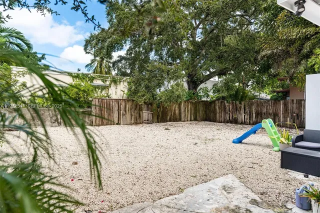 a view of outdoor space with seating and trees